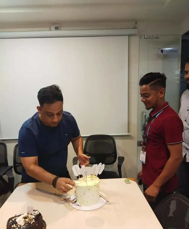 Cutting the cake with the team