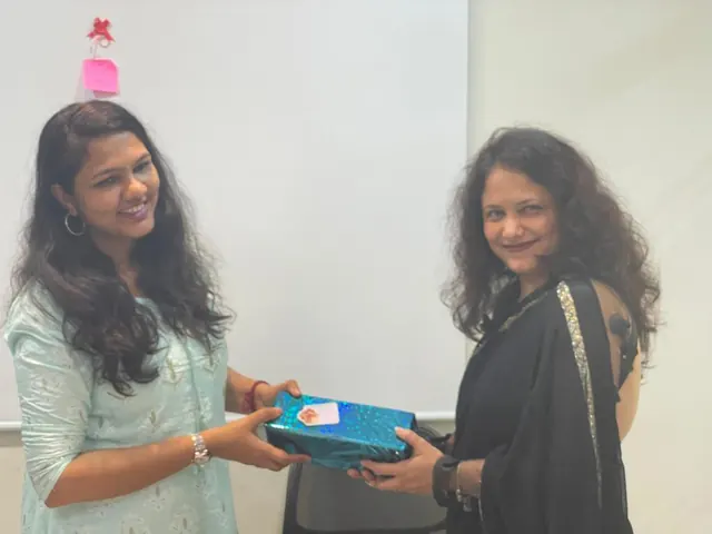 Handing over a Women's Day gift