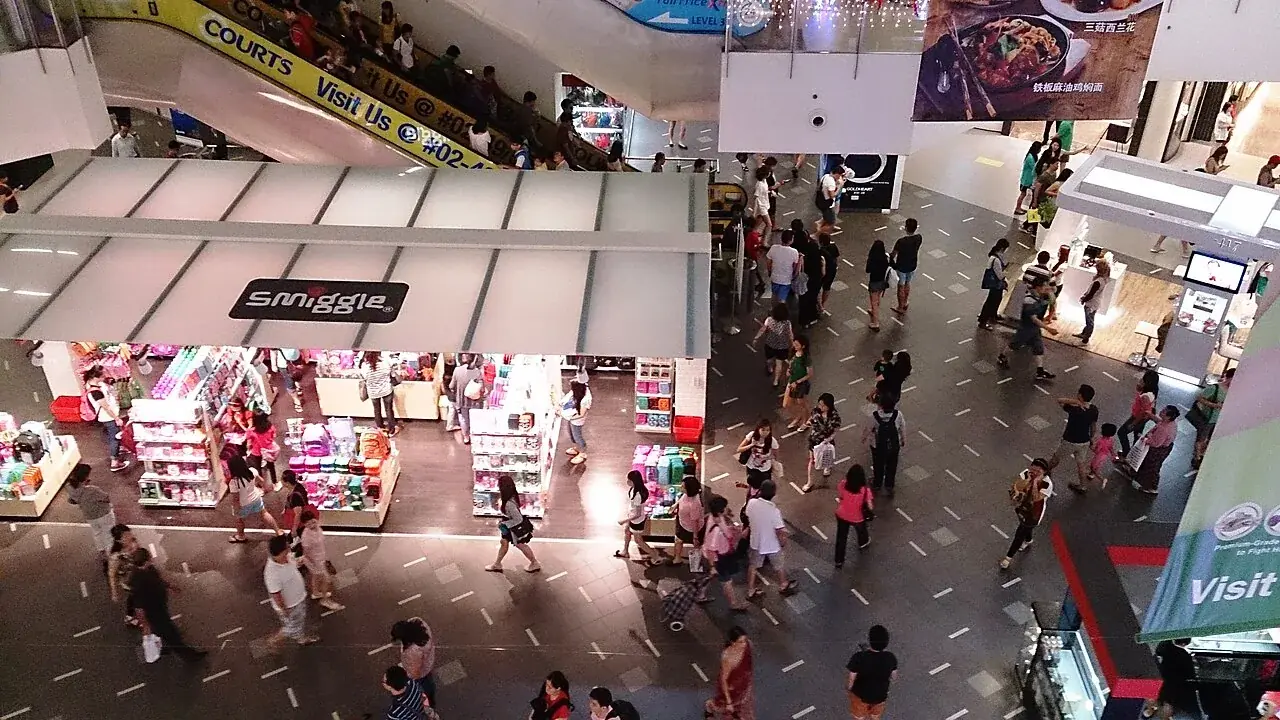 Shoppers crowding the floors of a multi-level shopping centre